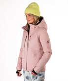 Woman wearing a pink jacket with black chest zippers on a white background