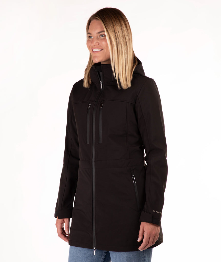 Woman wearing a black coat on a white background