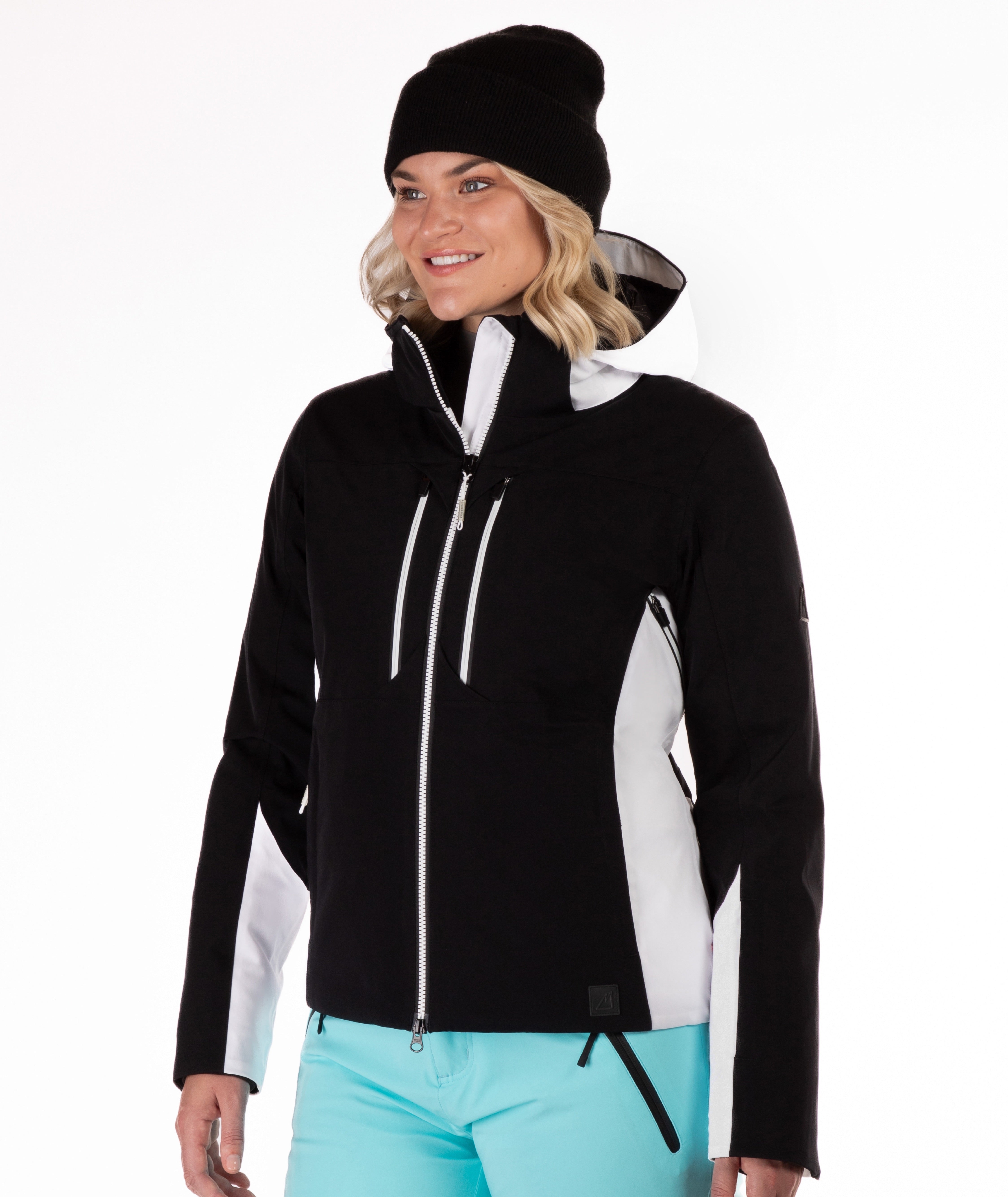 Woman wearing a black and white jacket on a white background