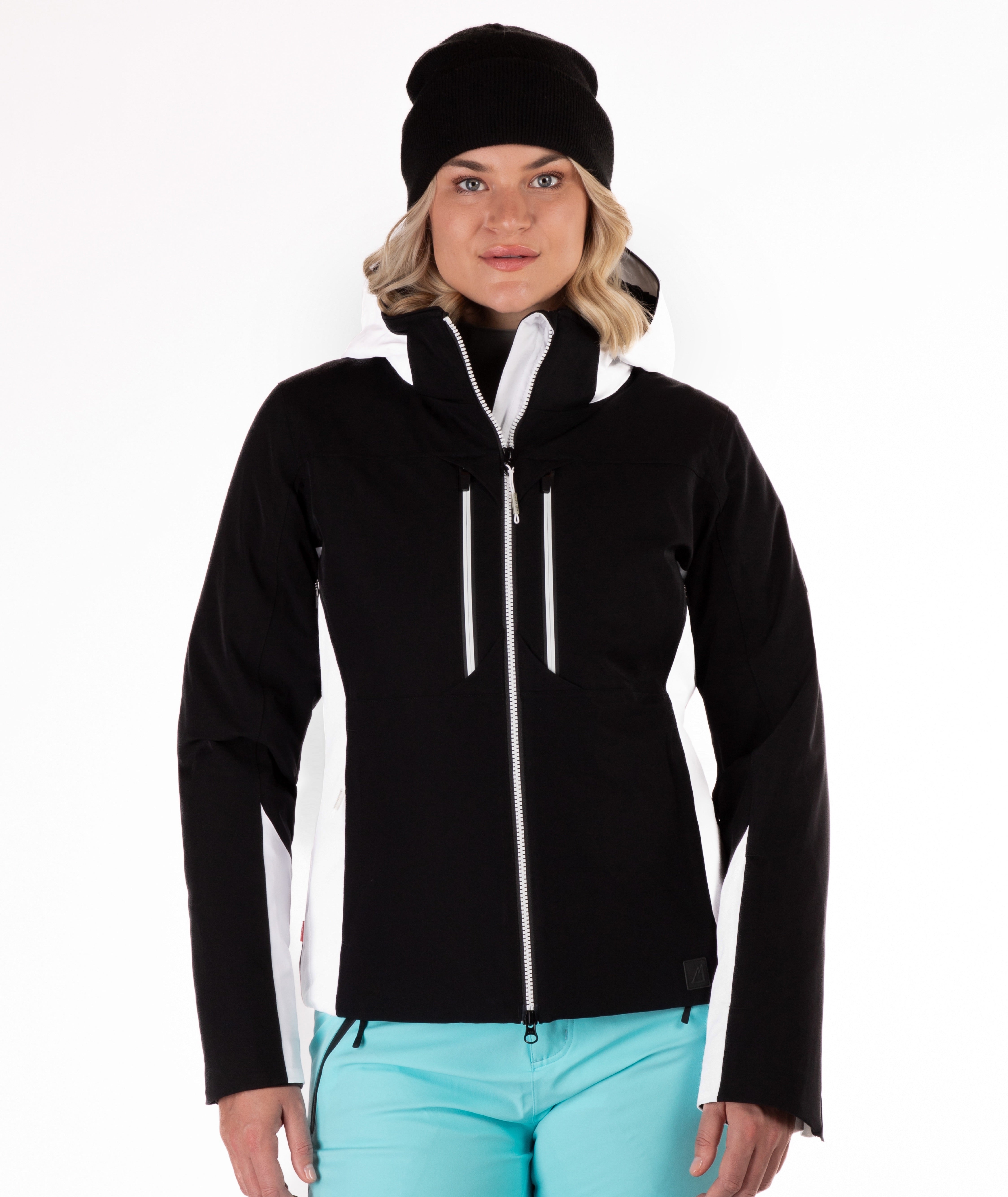 Woman wearing a black and white jacket on a white background