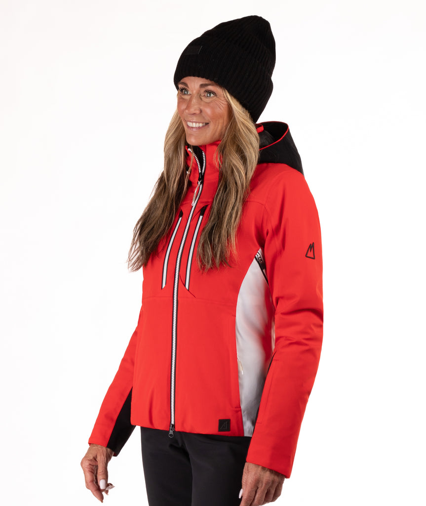 Woman wearing a red and black ski jacket on a white background
