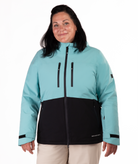 Woman wearing a light blue and black jacket on a white background