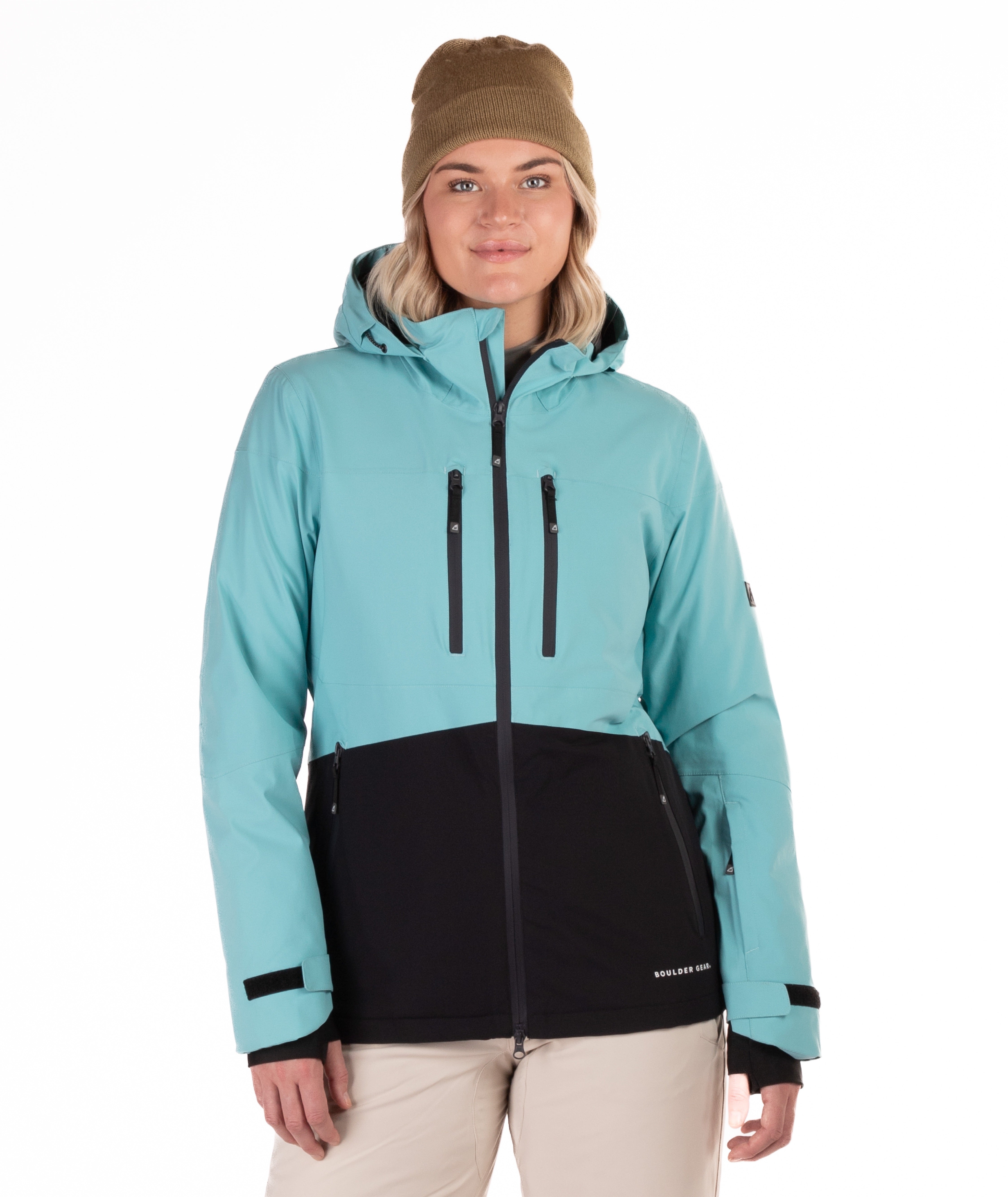 Person wearing a light blue and black jacket with a white background