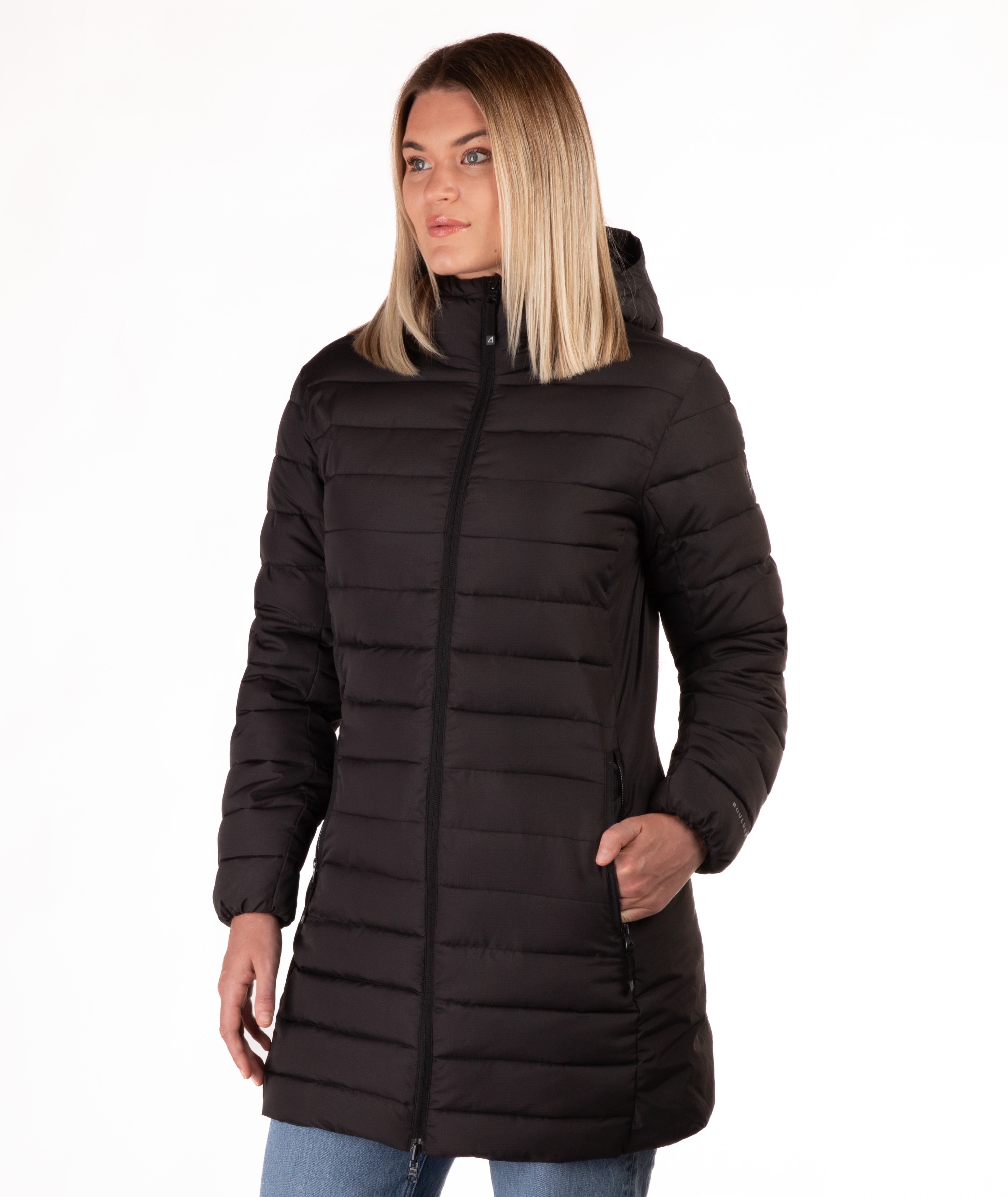 Woman wearing a black mid thigh length puffer coat on a white background