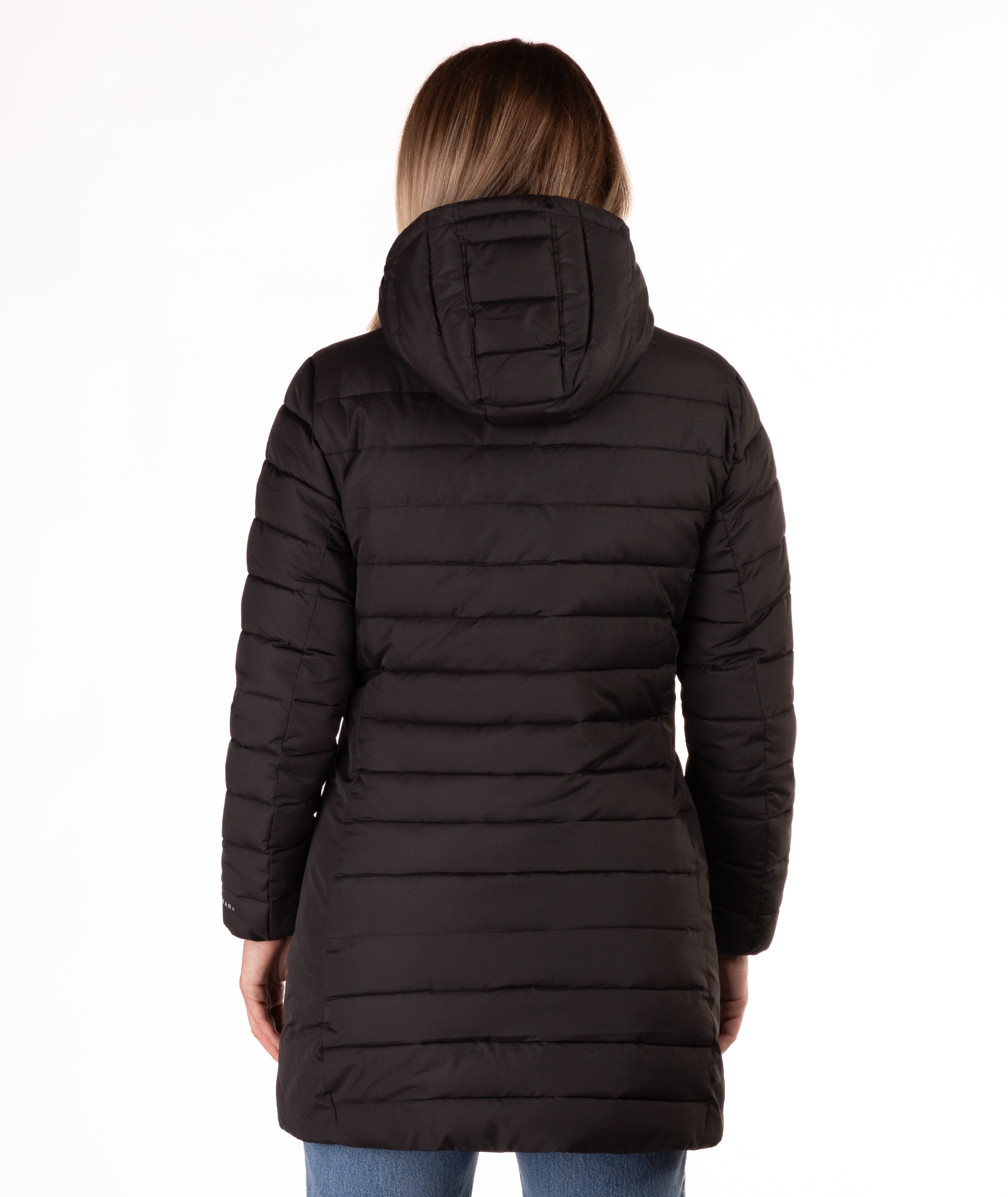 Woman wearing a black mid thigh length puffer coat on a white background