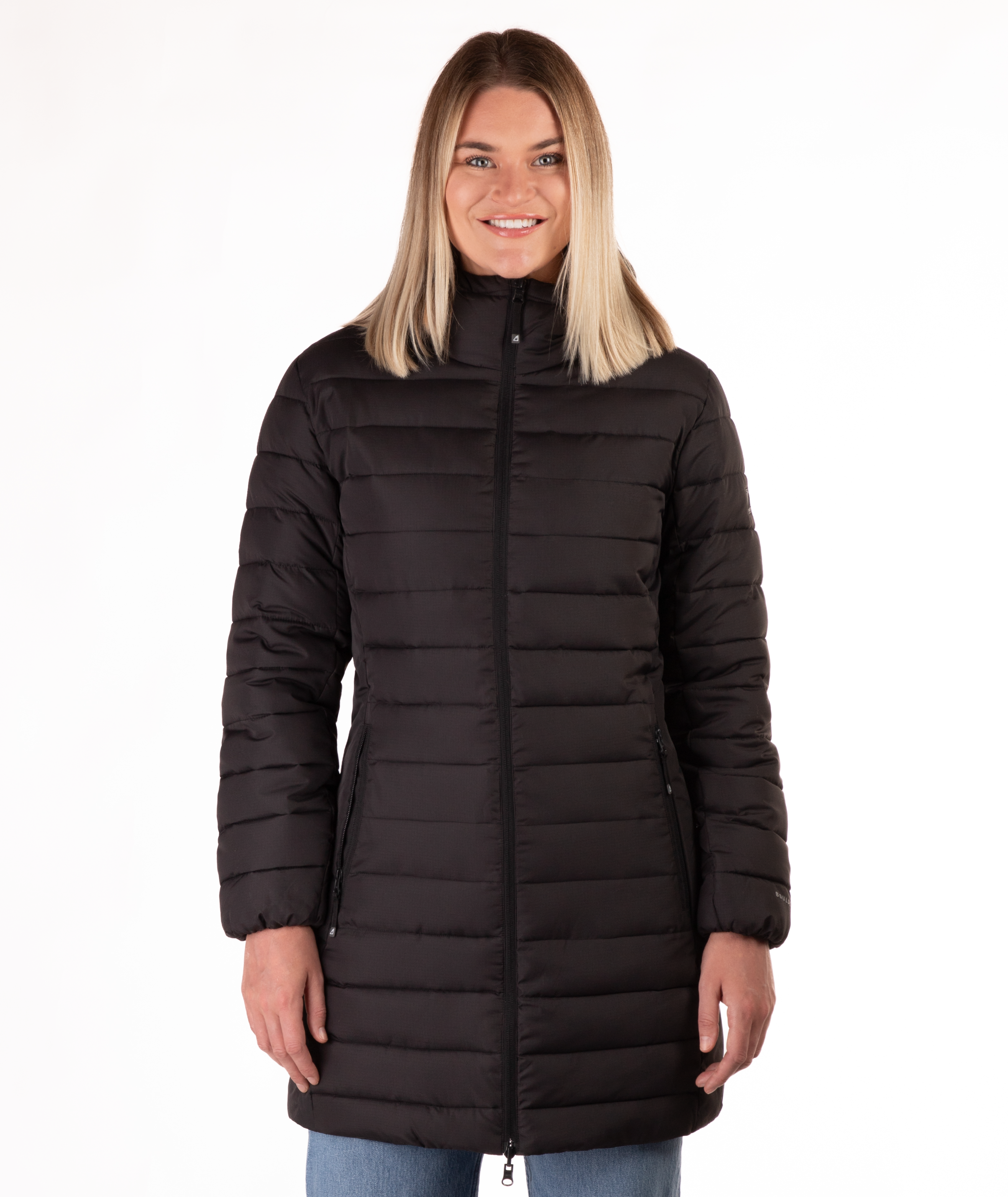 Woman wearing a black mid thigh length puffer coat on a white background