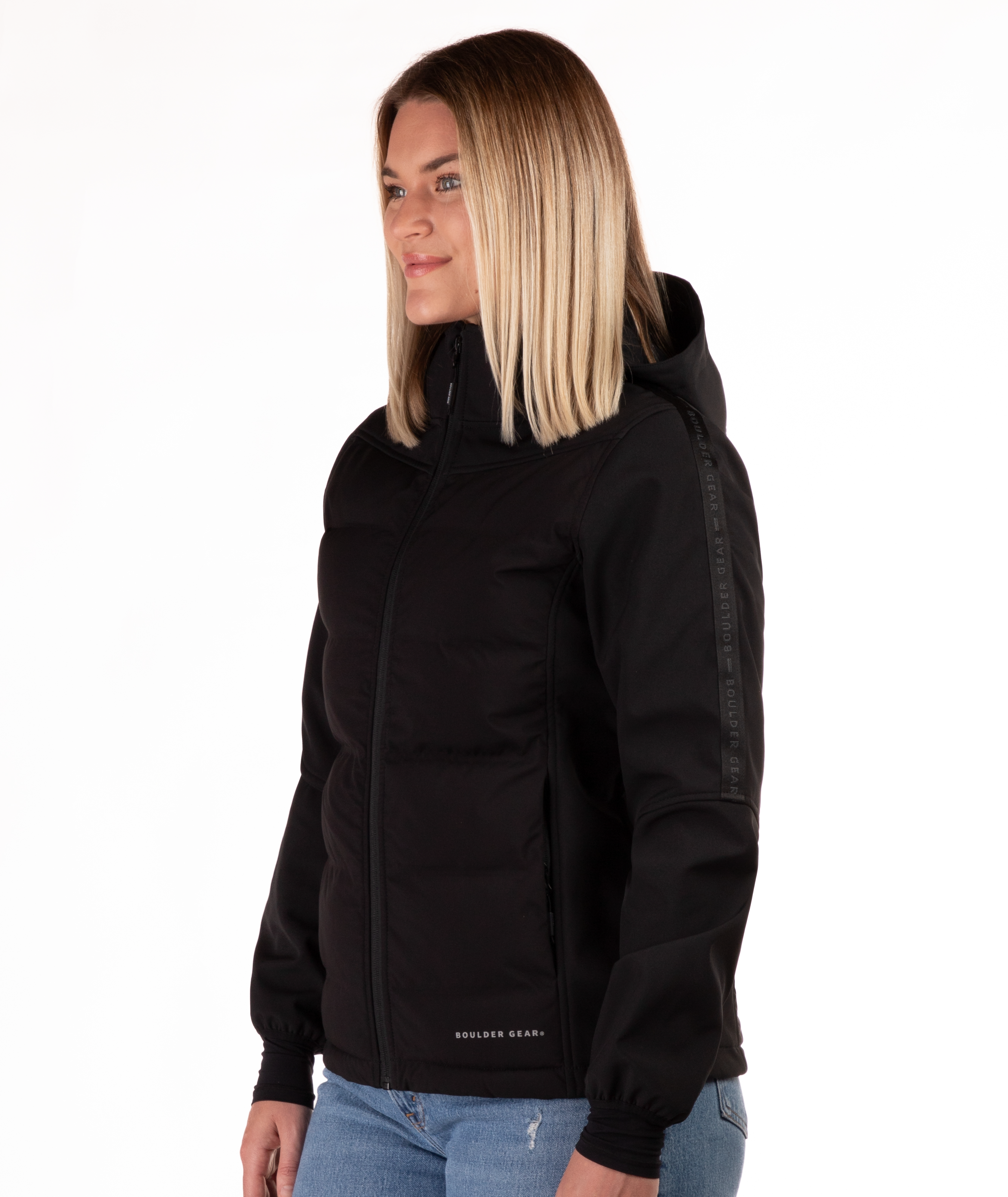 Woman wearing a black jacket with a hood  highlighting the sleeve detail on a white background