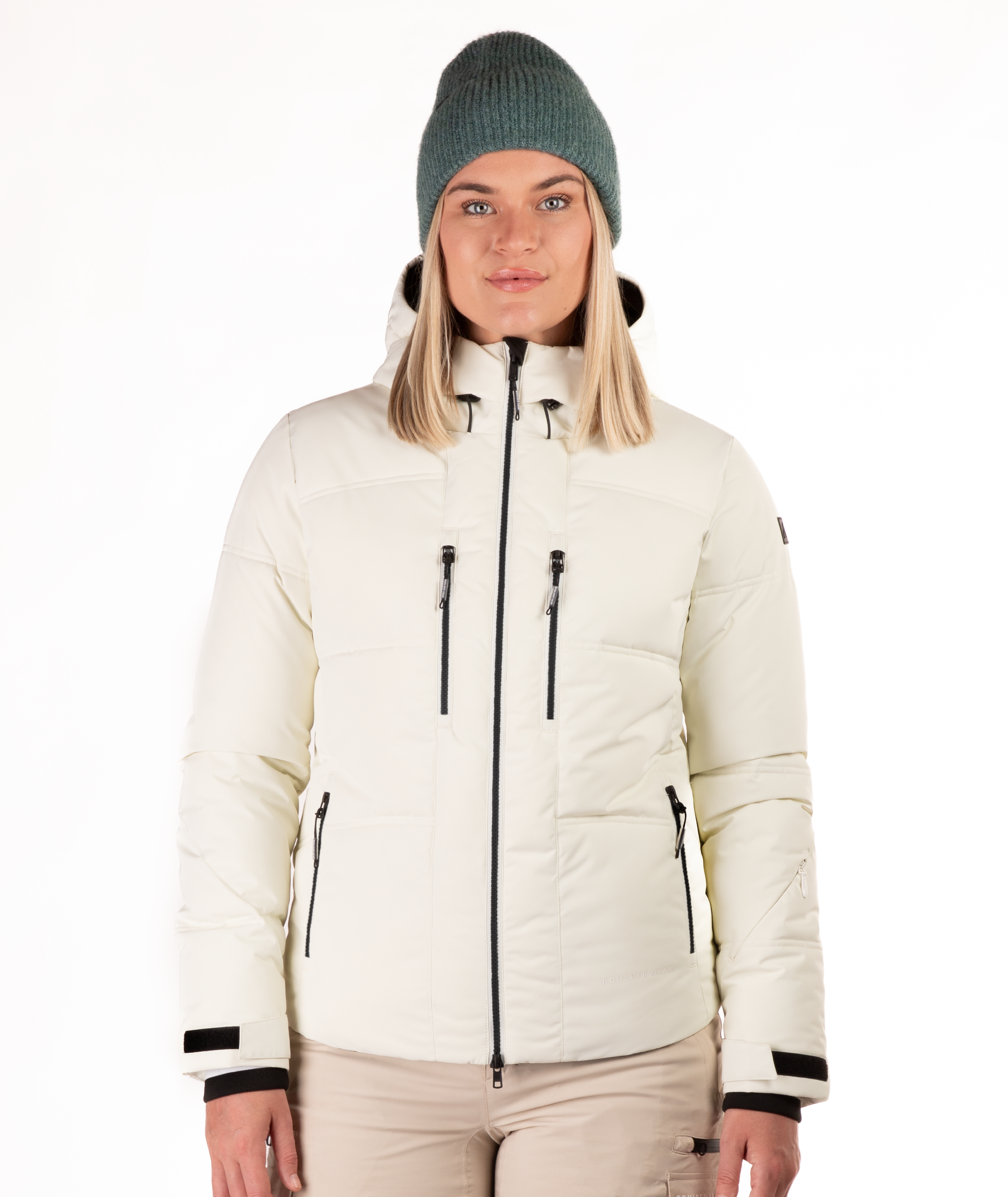 Woman wearing a white quilted winter jacket on a white background