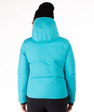 Person wearing a bright blue quilted winter jacket on a white background showing back of jacket and hood