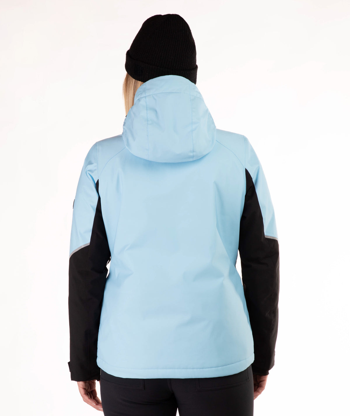 A person shown from the back wearing a light blue hooded jacket with black side panels and black sleeves, along with a black beanie, against a plain white studio background.