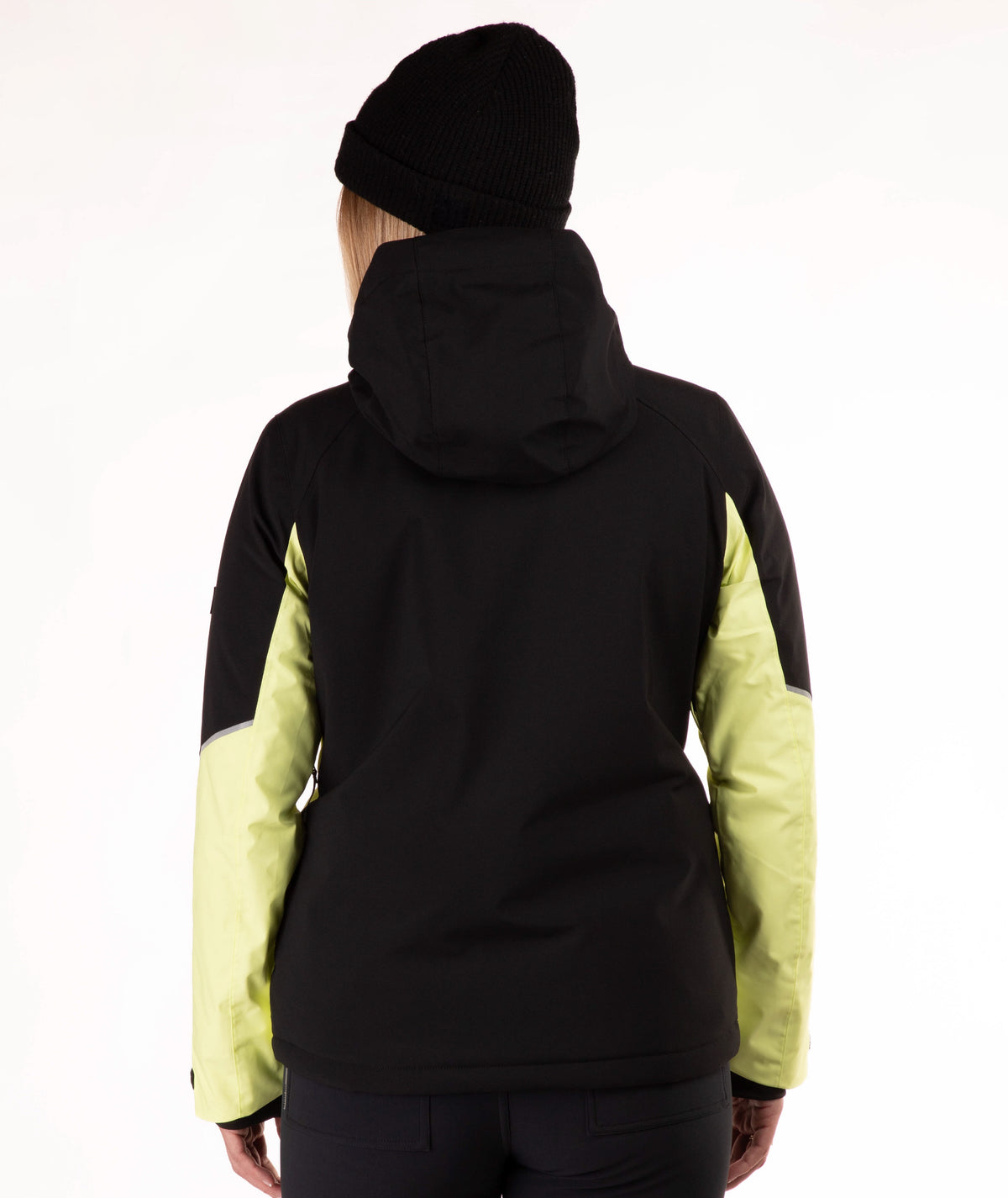A person shown from the back wearing a black hooded jacket with light yellow color-blocked sleeves, paired with a black beanie against a plain white studio background.