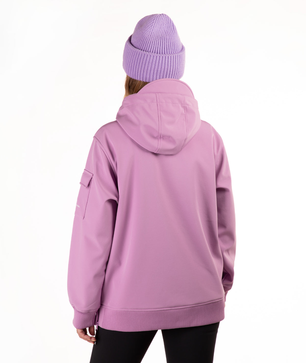 A person shown from the back wearing a lavender-purple hooded jacket and a matching ribbed knit beanie against a plain white studio background.