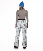 back of Person wearing floral patterned pants on a white background