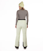 back of Person wearing light green pants on a white background