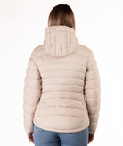 back of a beige puffer jacket worn by a person on a white background