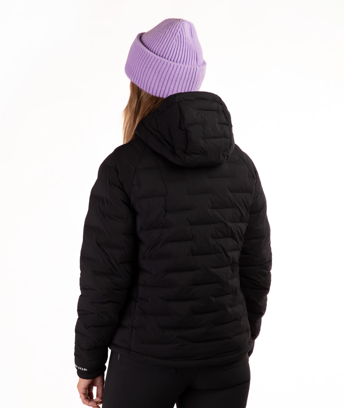 A person shown from the back wearing a black quilted puffer jacket and a light purple ribbed knit beanie against a plain white background.