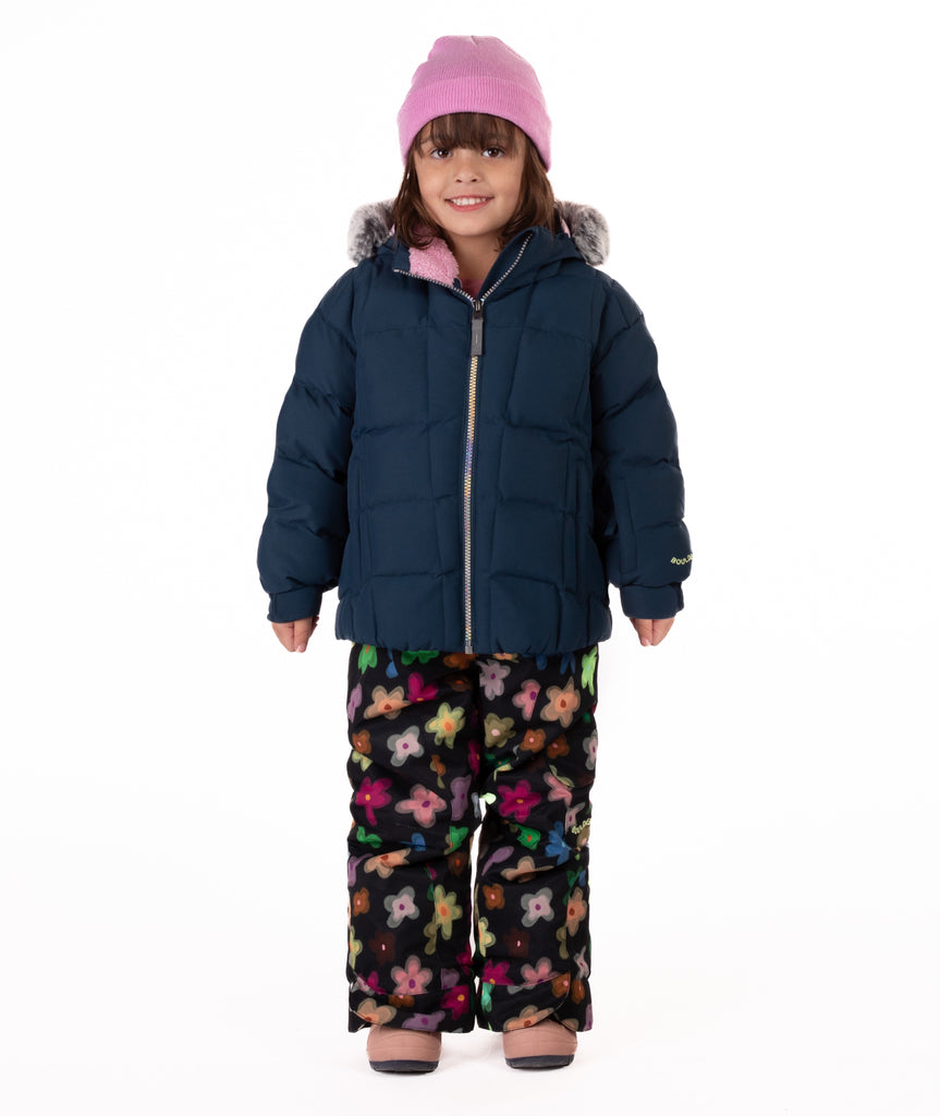 Child wearing a navy blue quilted puffy winter coat on a white background