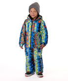 Child wearing a yellow, blue, and orange multi color geometric print quilted winter jacket with chest pockets and hand-warmer pockets on a white background