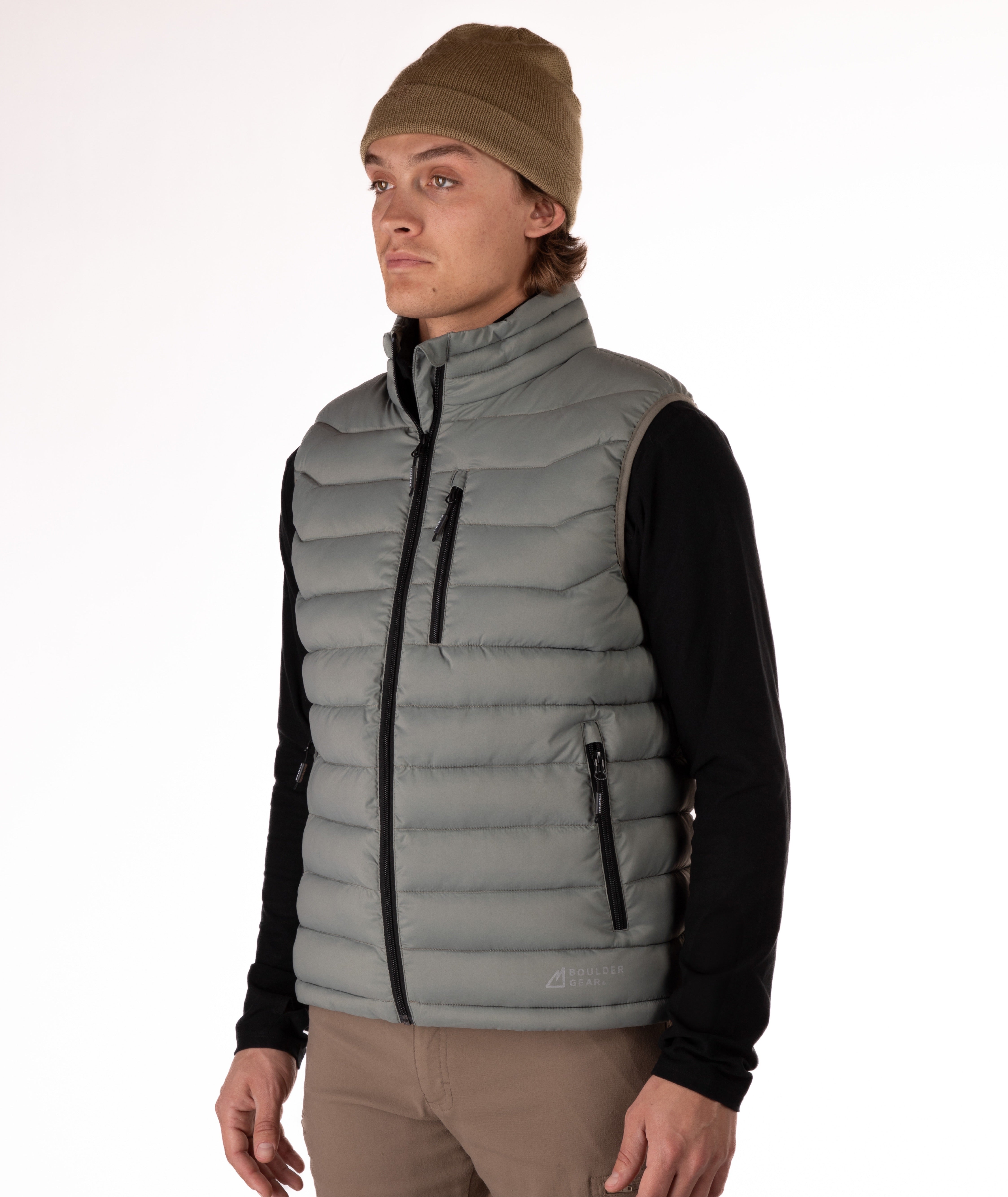 Man wearing a beige puffer vest over a black shirt on a white background