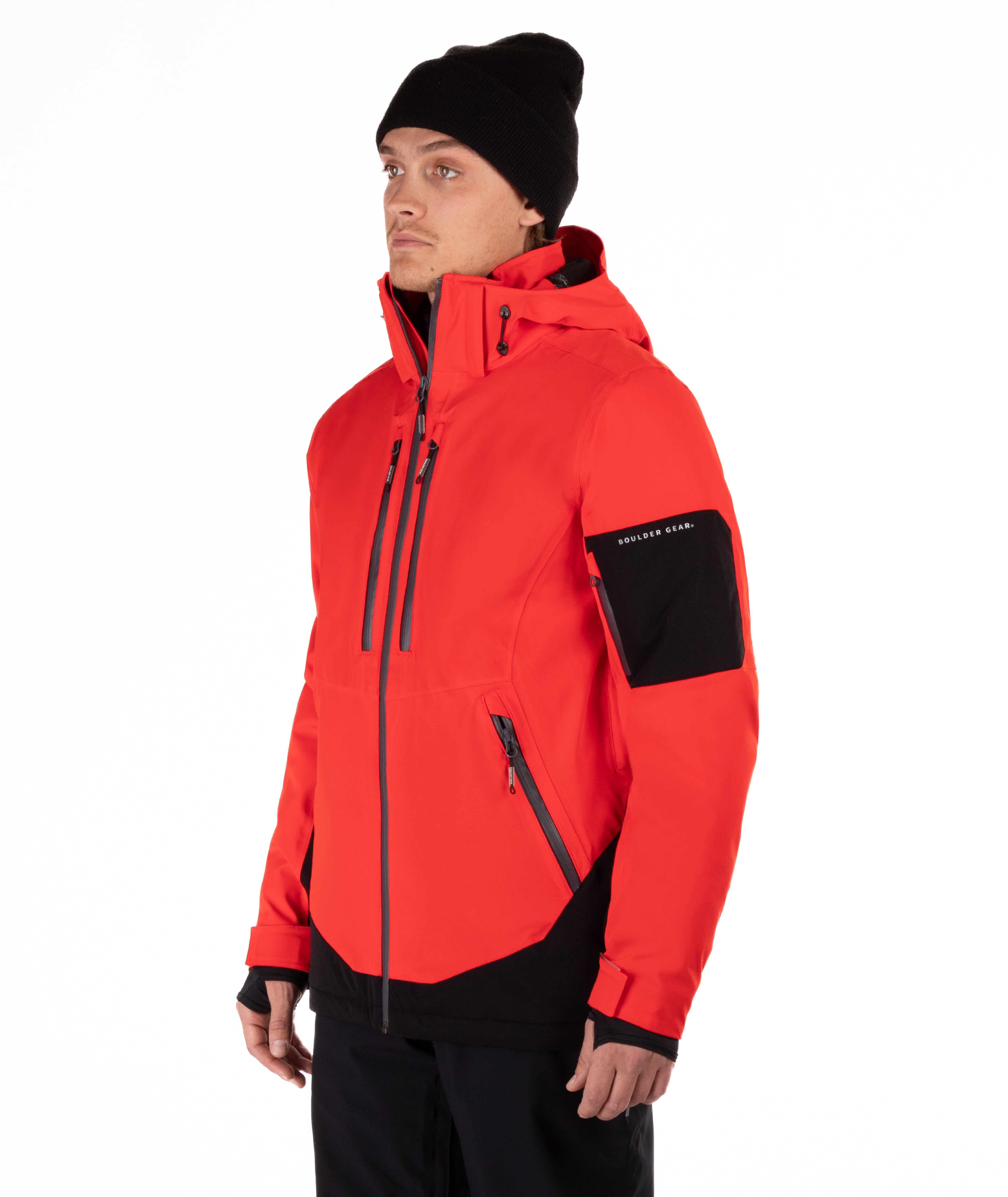 Person wearing a red jacket with black accents on a white background