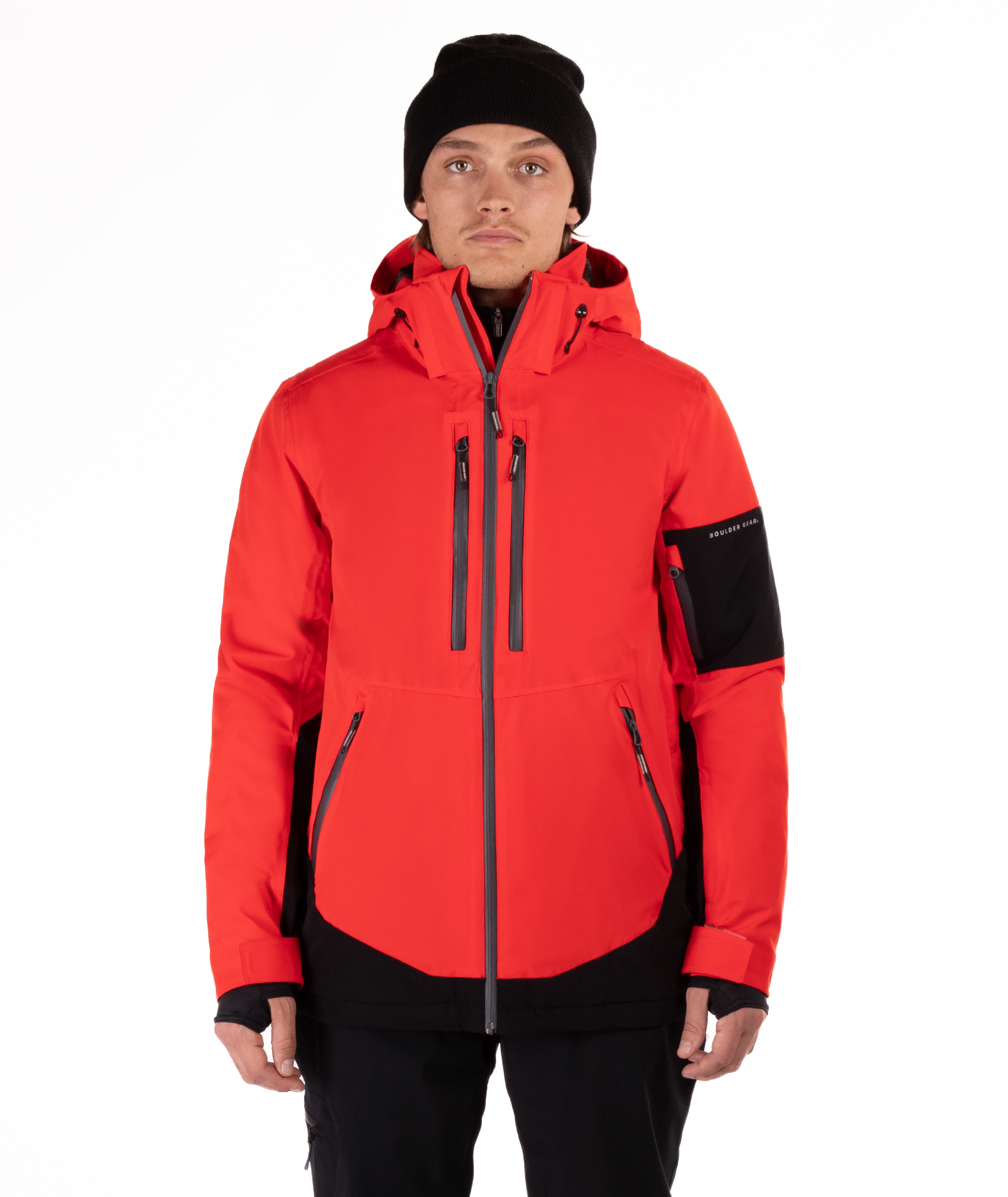 Person wearing a red jacket with black accents on a white background