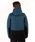 A man viewed from the back wearing a teal blue hooded ski jacket with black color blocking on the lower back and sleeves, set against a plain white studio background.