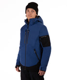 Person wearing a blue jacket with black accents on a white background