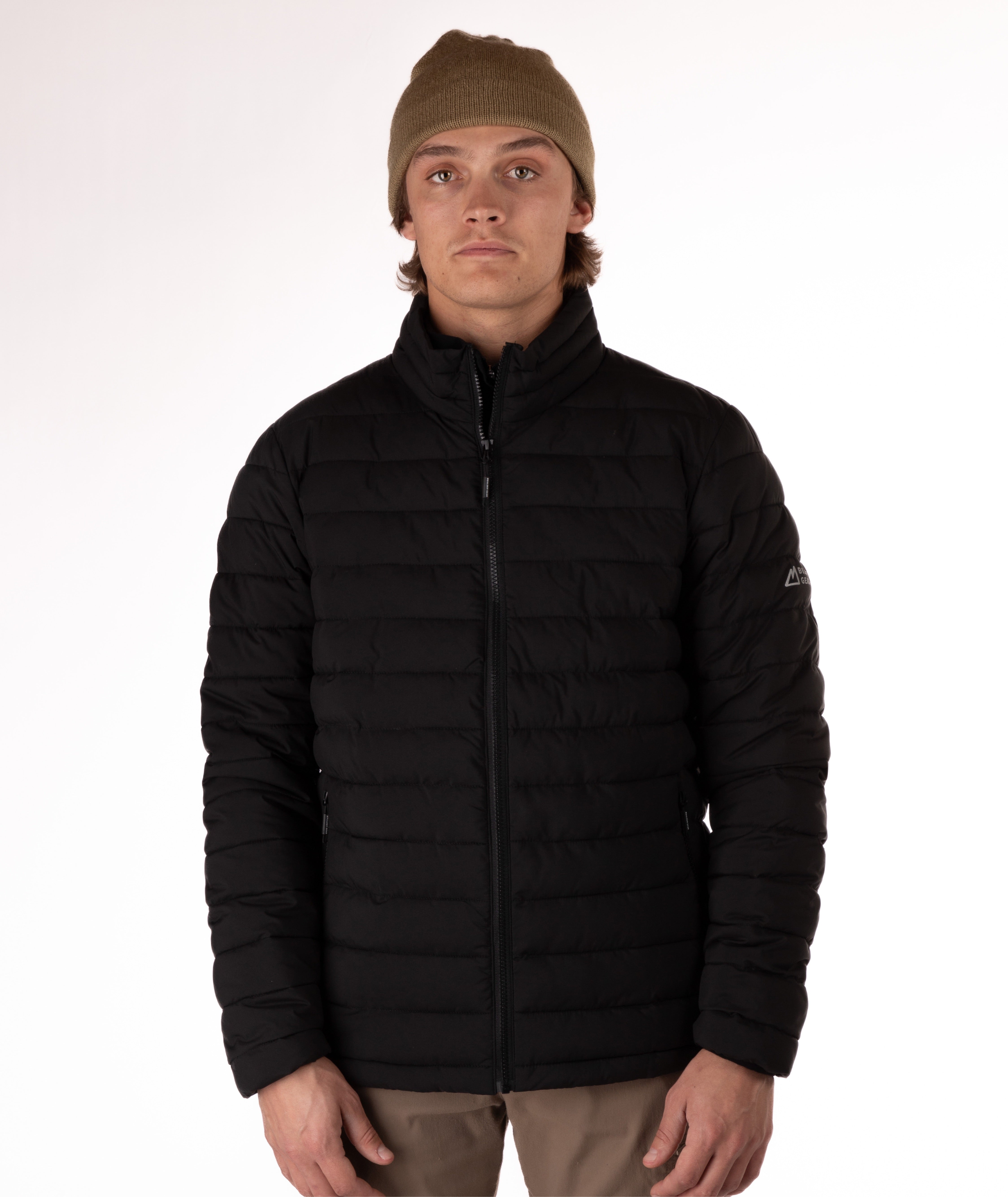 Man wearing a black puffer jacket on a white background