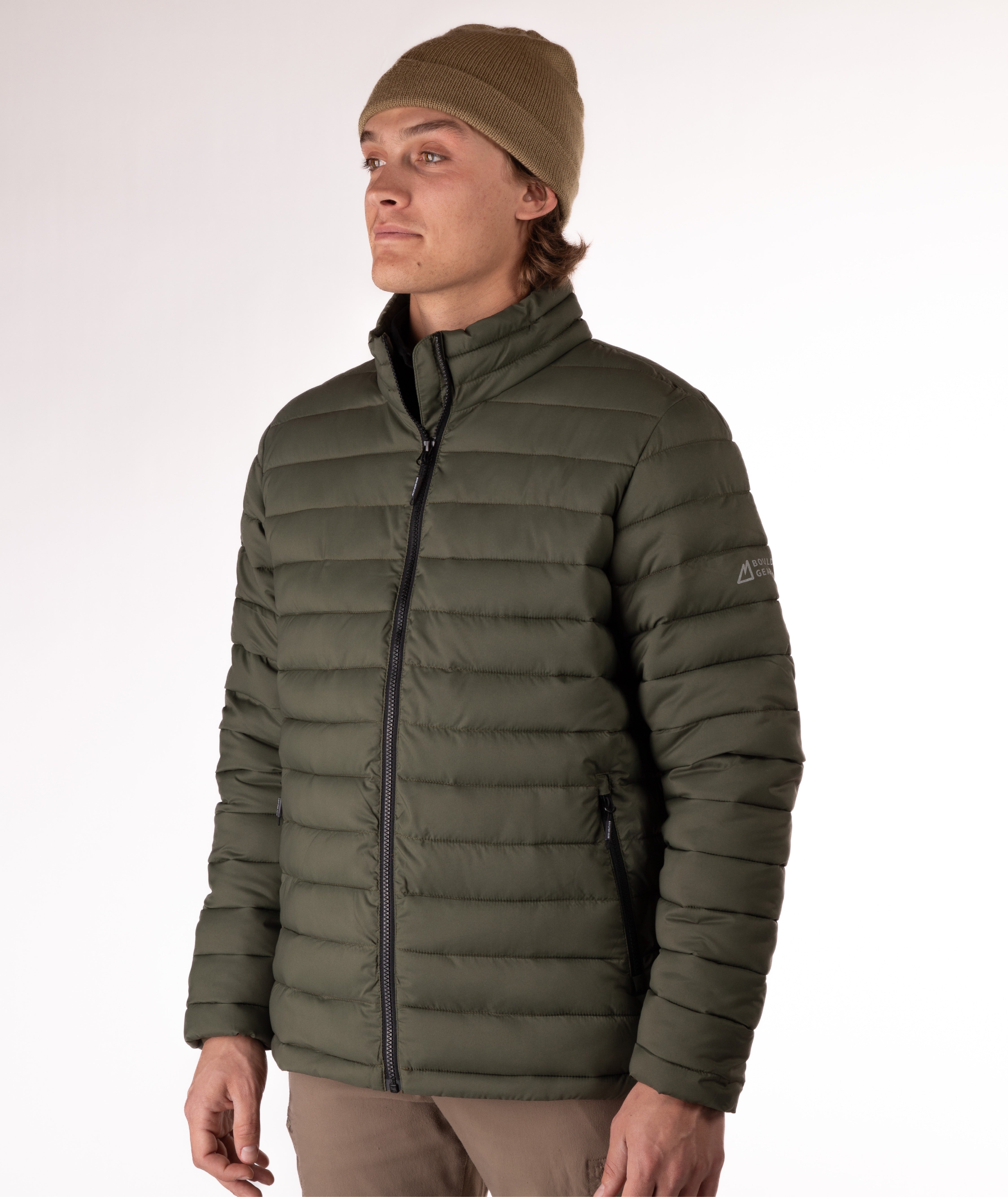 Man wearing a green puffer jacket on a white background