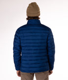 back of Man wearing a navy blue puffer jacket on a white background