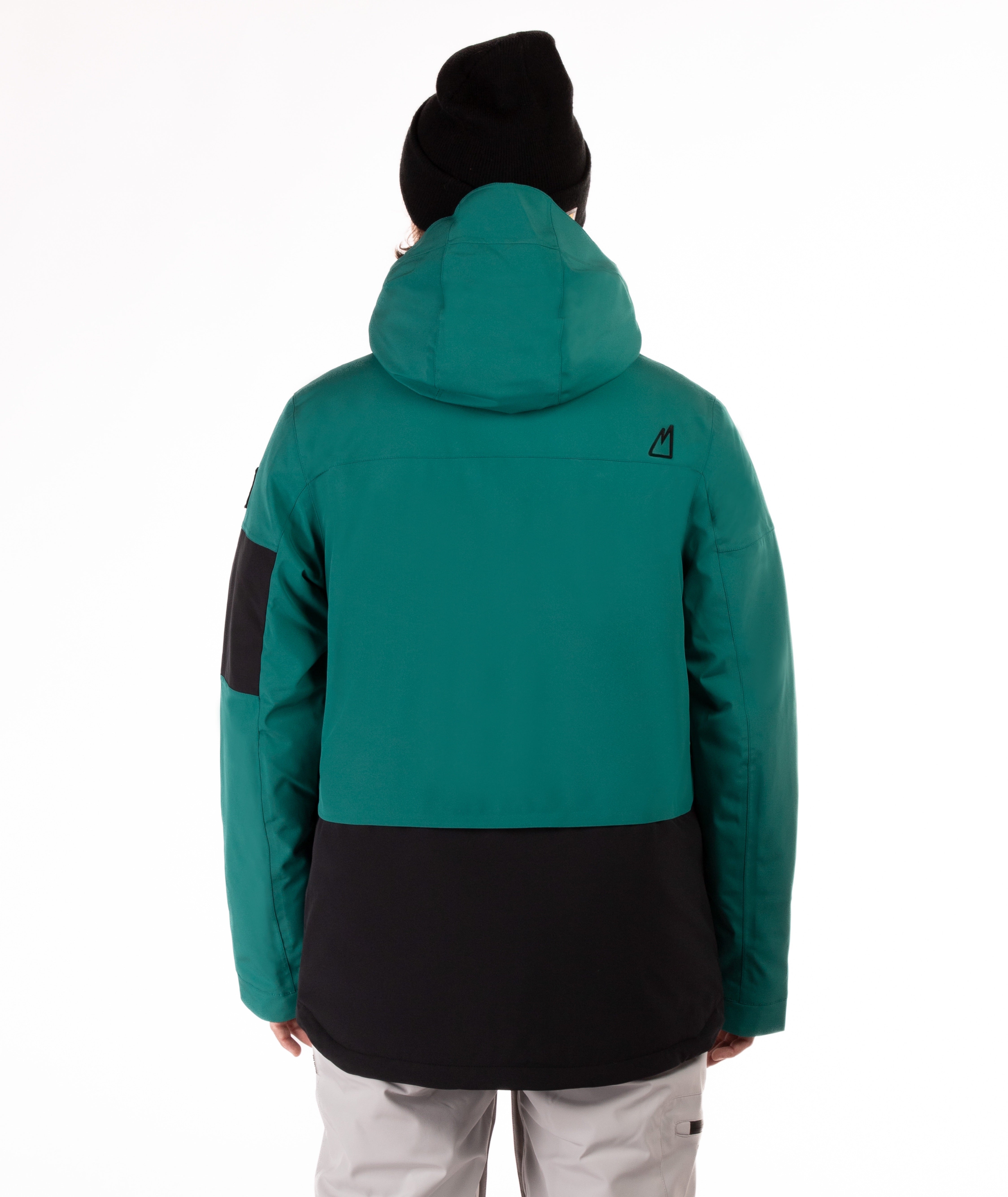 a person wearing a teal and black jacket with hood on a white background