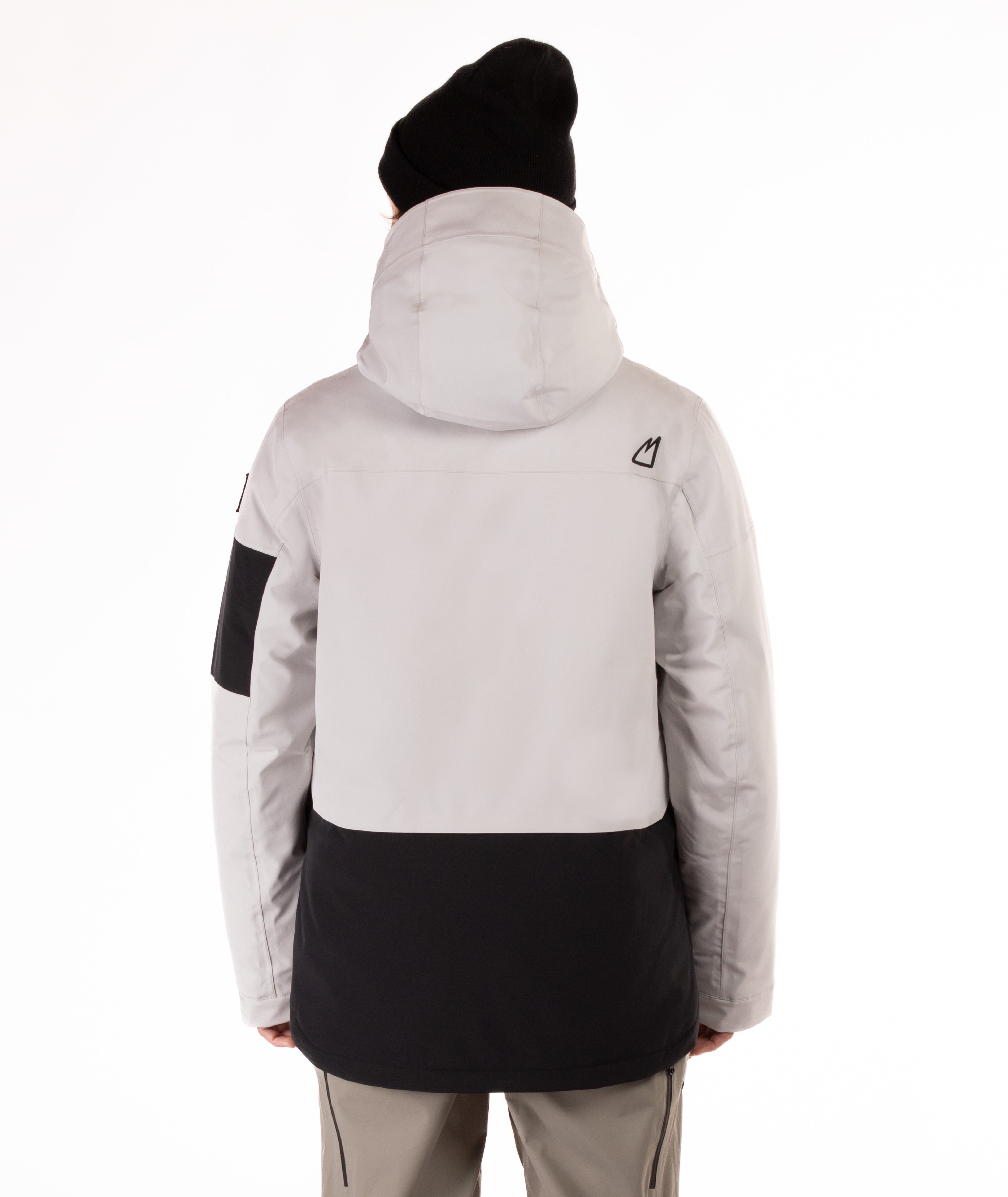 back of person wearing a gray and black jacket with hood on a white background