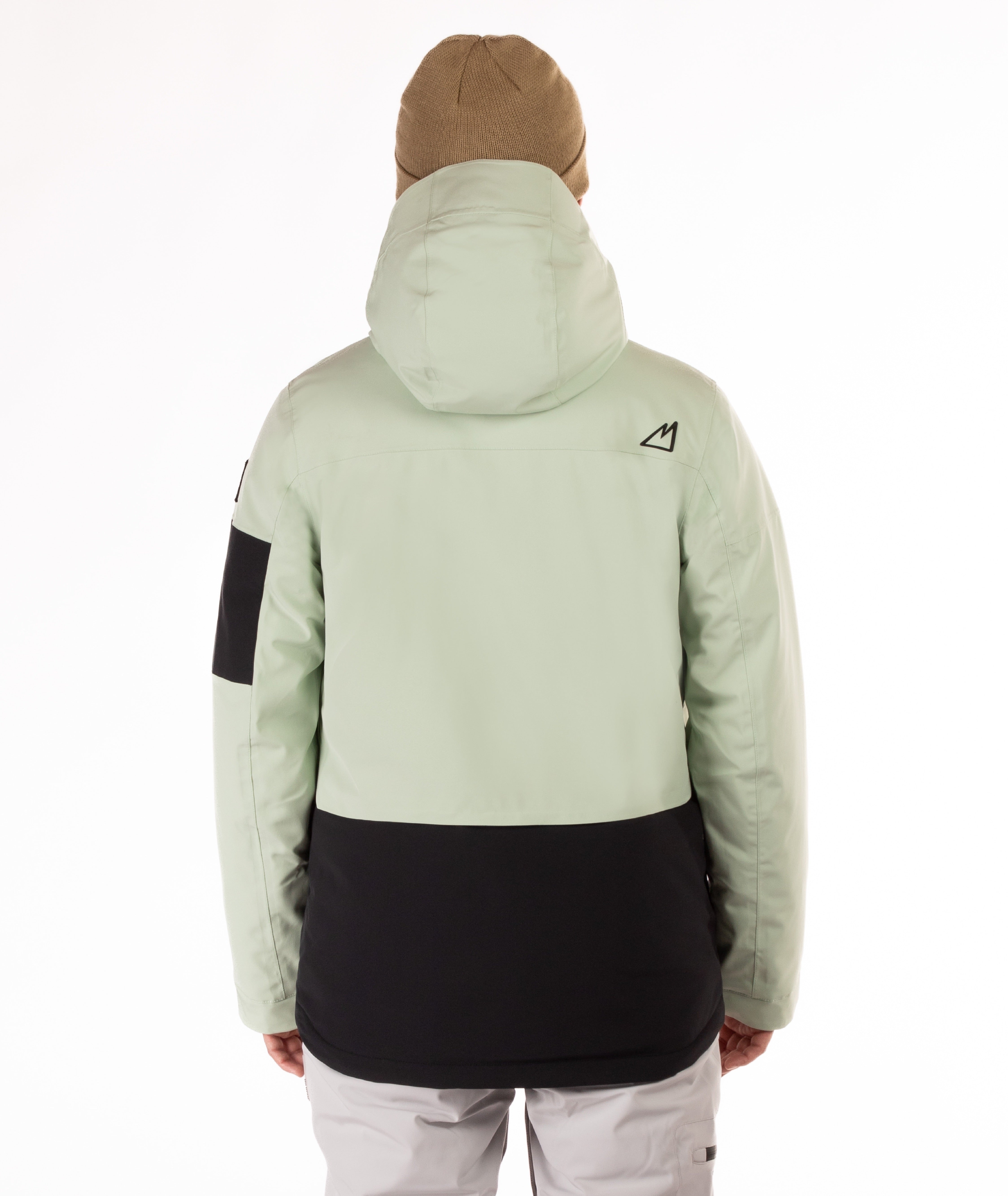 back of person wearing a light green and black jacket with hood on a white background