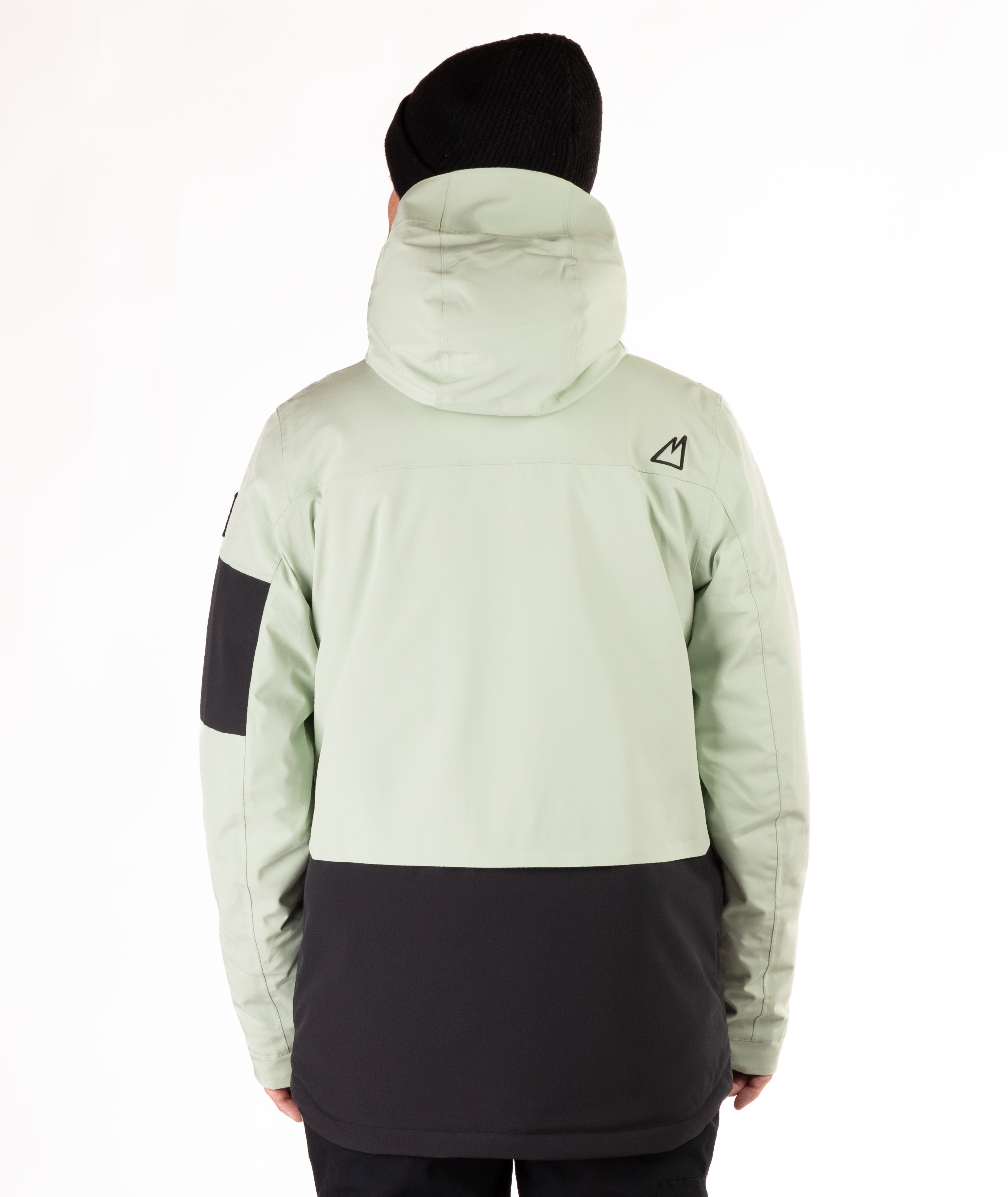 back of person wearing a light green and black jacket on a white background