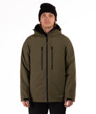 Man wearing a green jacket with black zippers on a white background