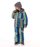 Child wearing a yellow, blue, and orange multi color geometric print quilted winter jacket with chest pockets and hand-warmer pockets on a white background