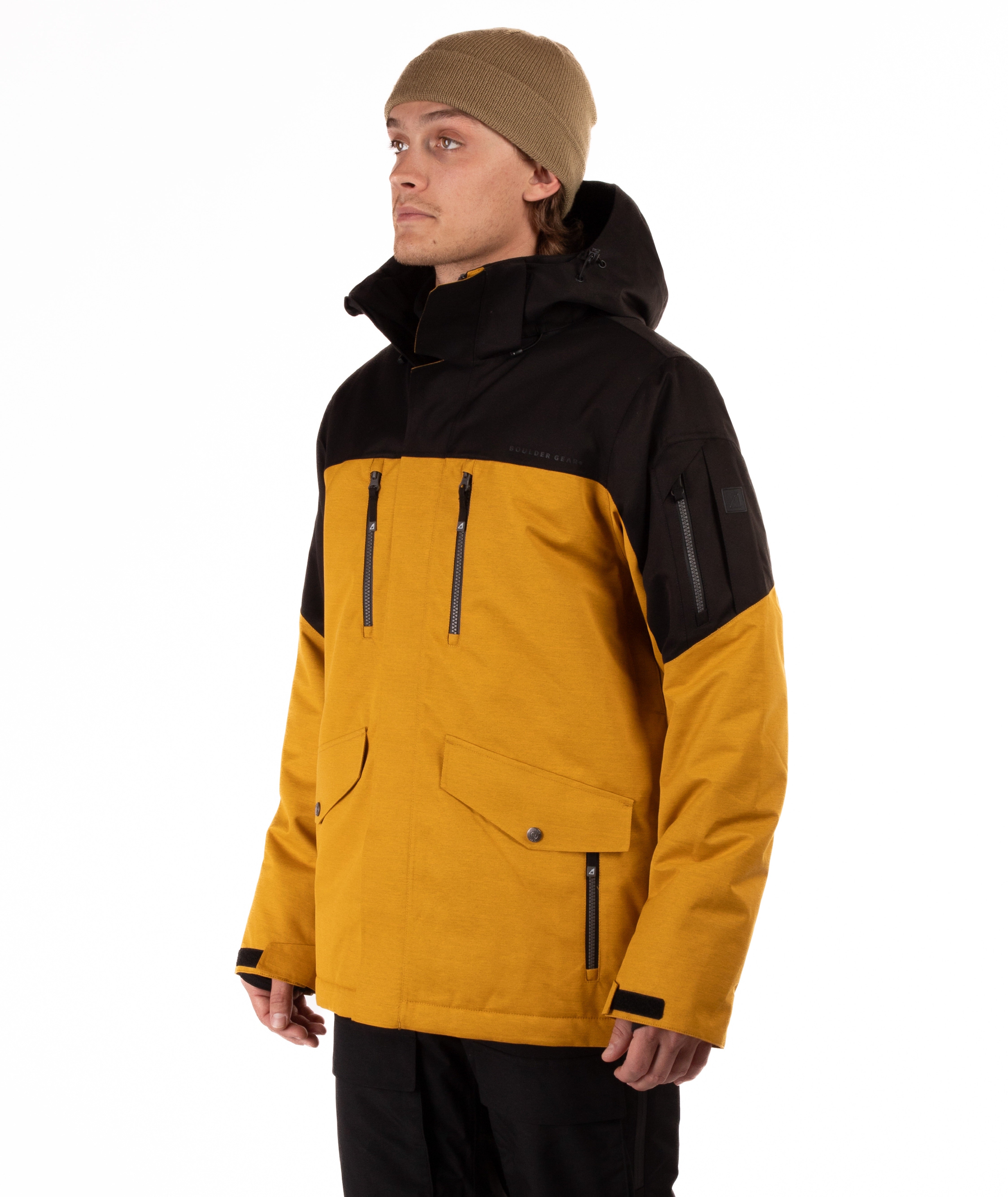 Person wearing a black and mustard yellow jacket on a white background