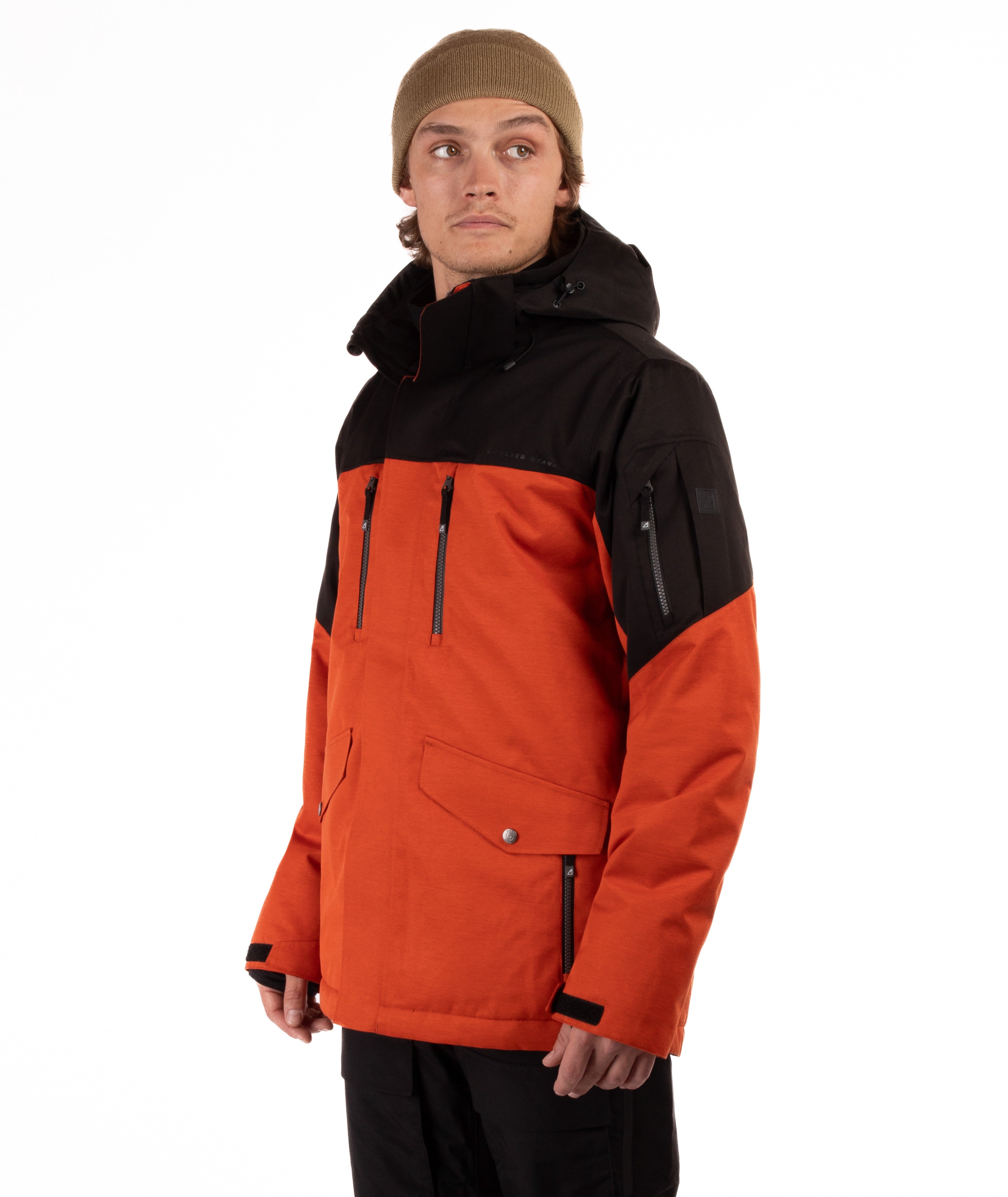 Person wearing a black and orange jacket on a white background
