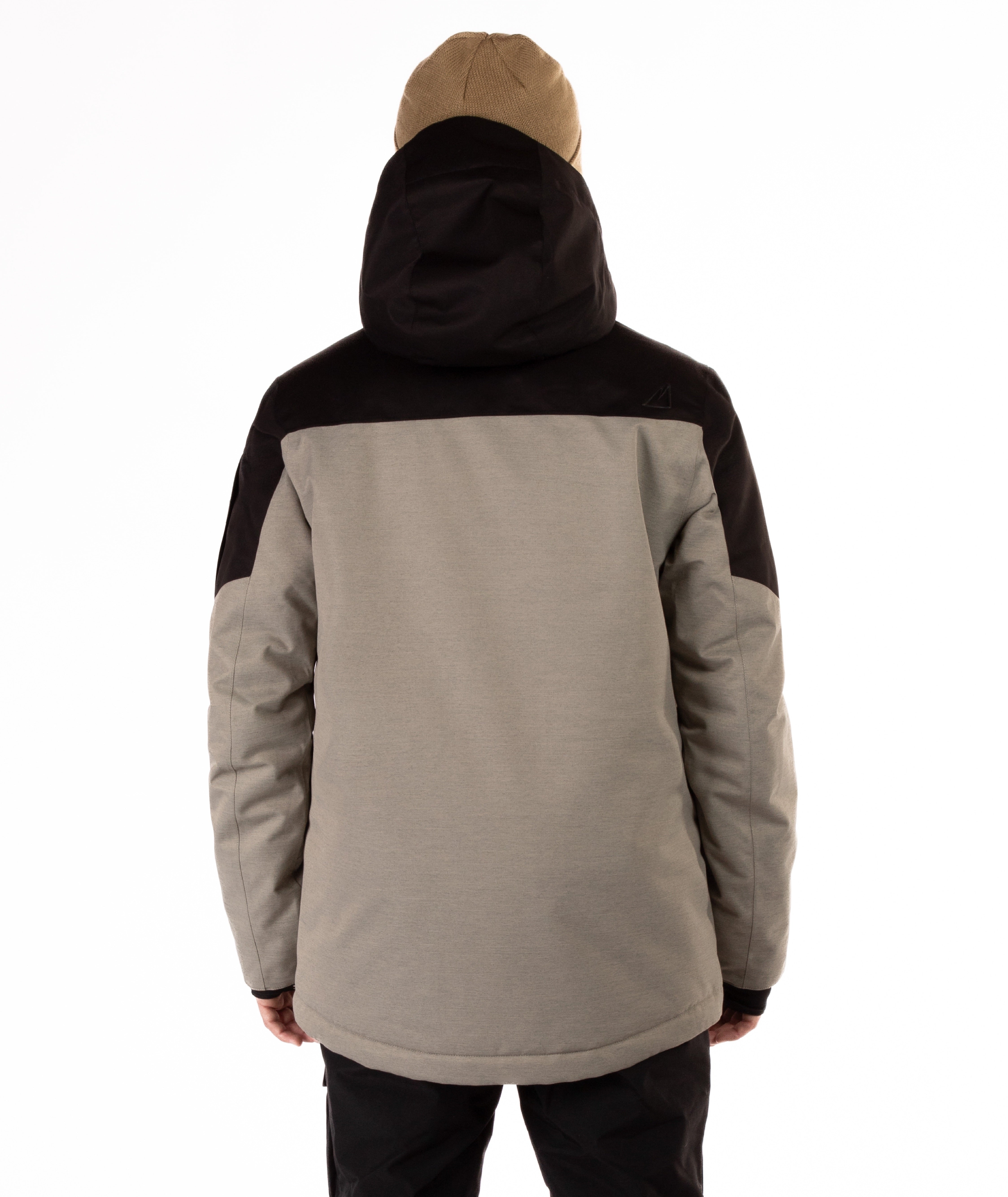 Person wearing a two-tone jacket with black and gray sections on a white background