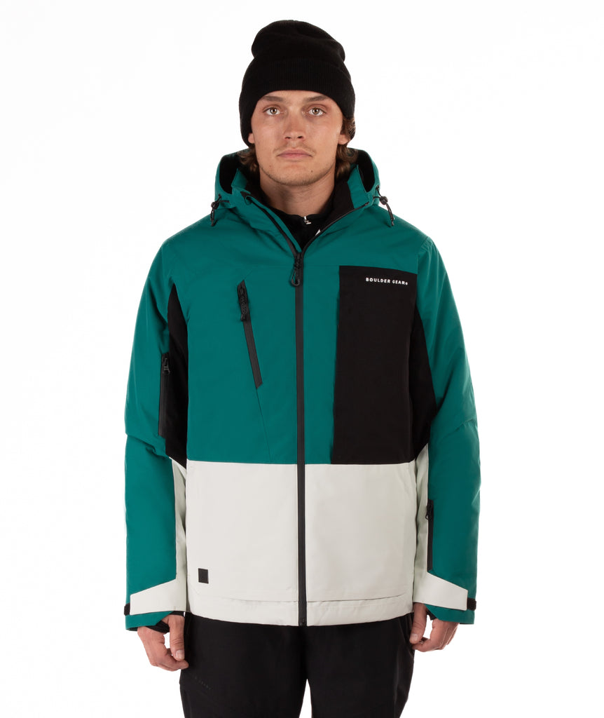 Person wearing a green, black, and white jacket with a visible brand logo on a white background