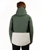 A person shown from the back wearing a colorblock hooded jacket. The jacket features a dark green upper body and sleeves, black side panels, and a large light green colorblock panel across the lower back.