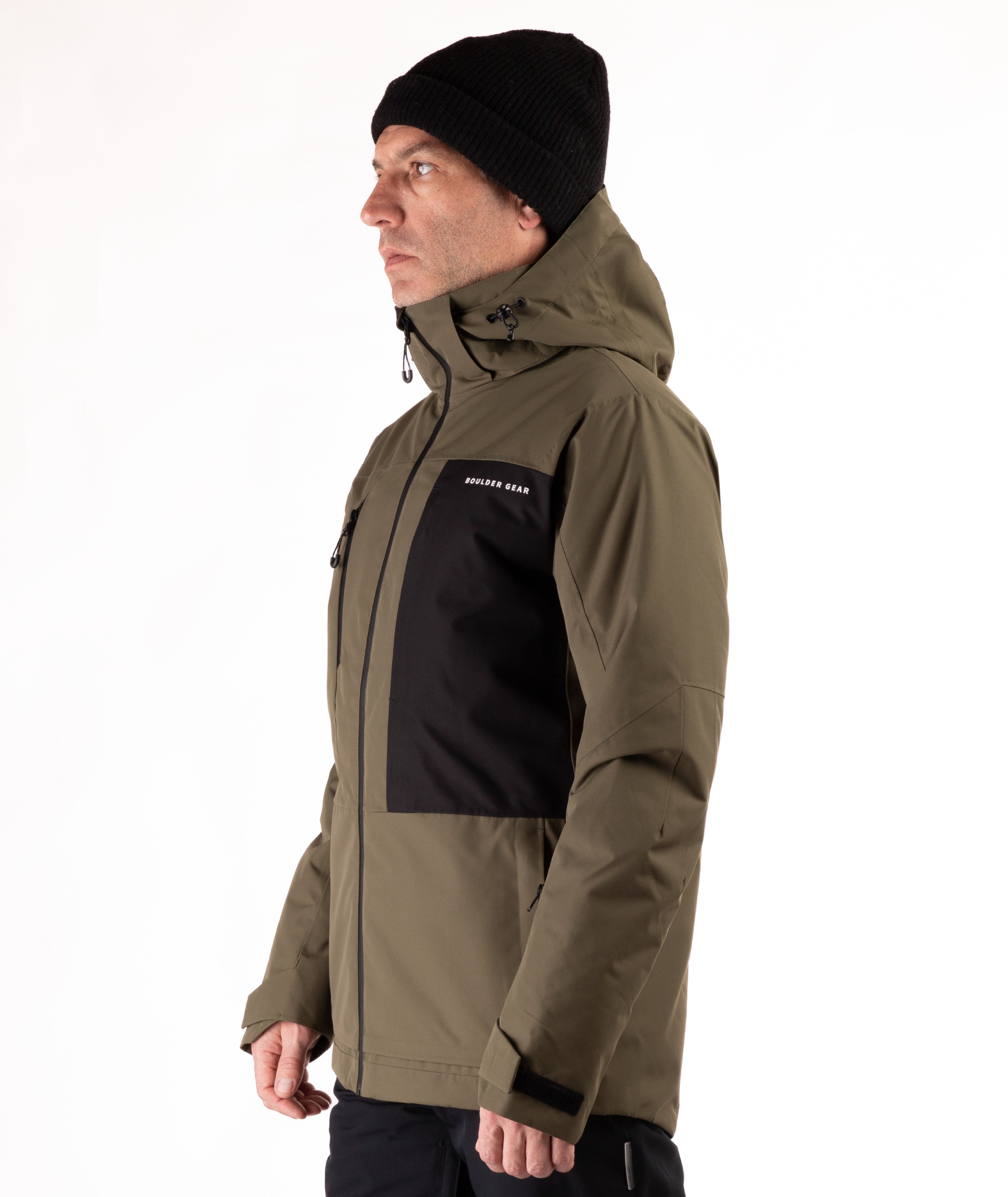 Person wearing a green and black jacket with a visible brand logo on a white background