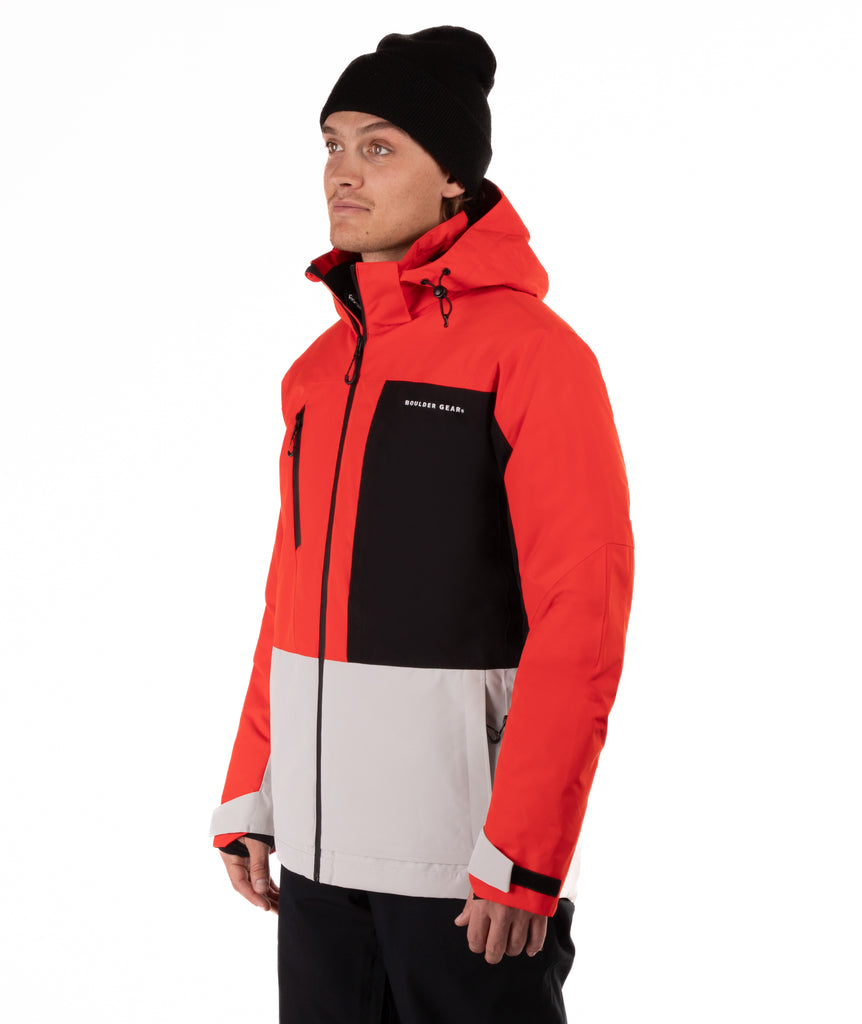 Person wearing a red, black, and gray jacket with a visible brand logo on a white background