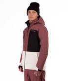 Person wearing a maroon and black jacket with a white panel on a white background