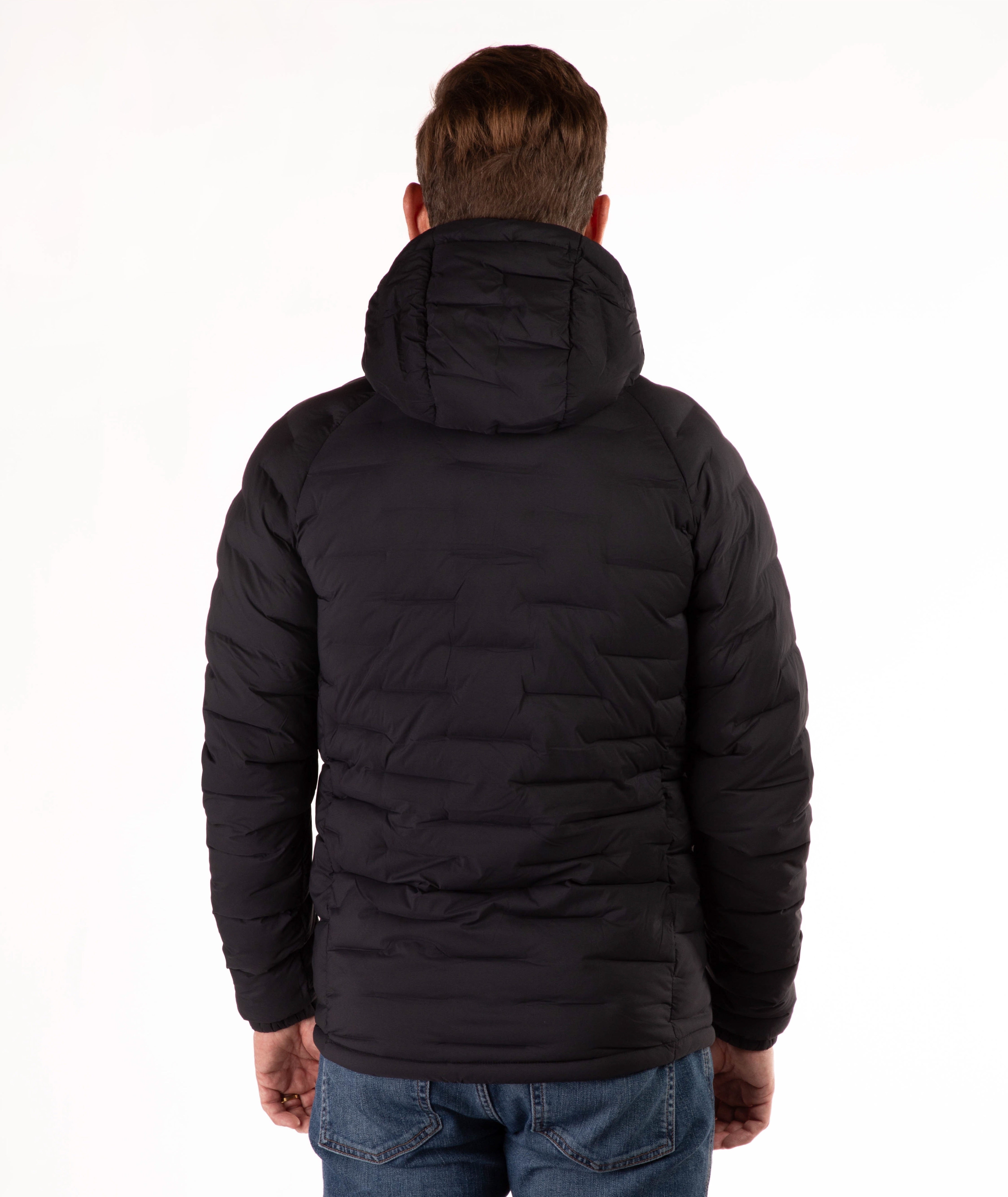 Person wearing a black puffer jacket on a white background