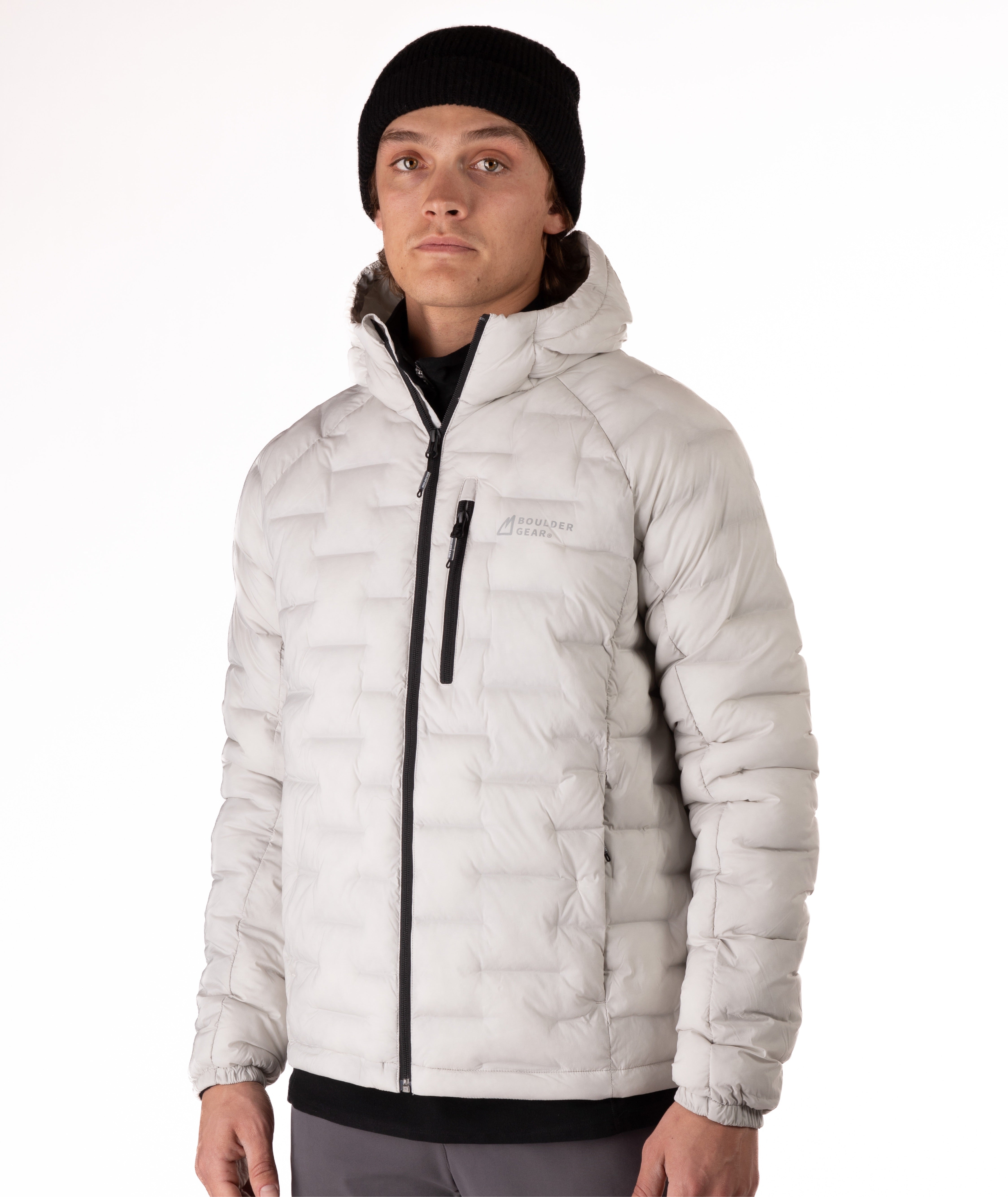 Person wearing a light gray jacket with a black zipper on a white background