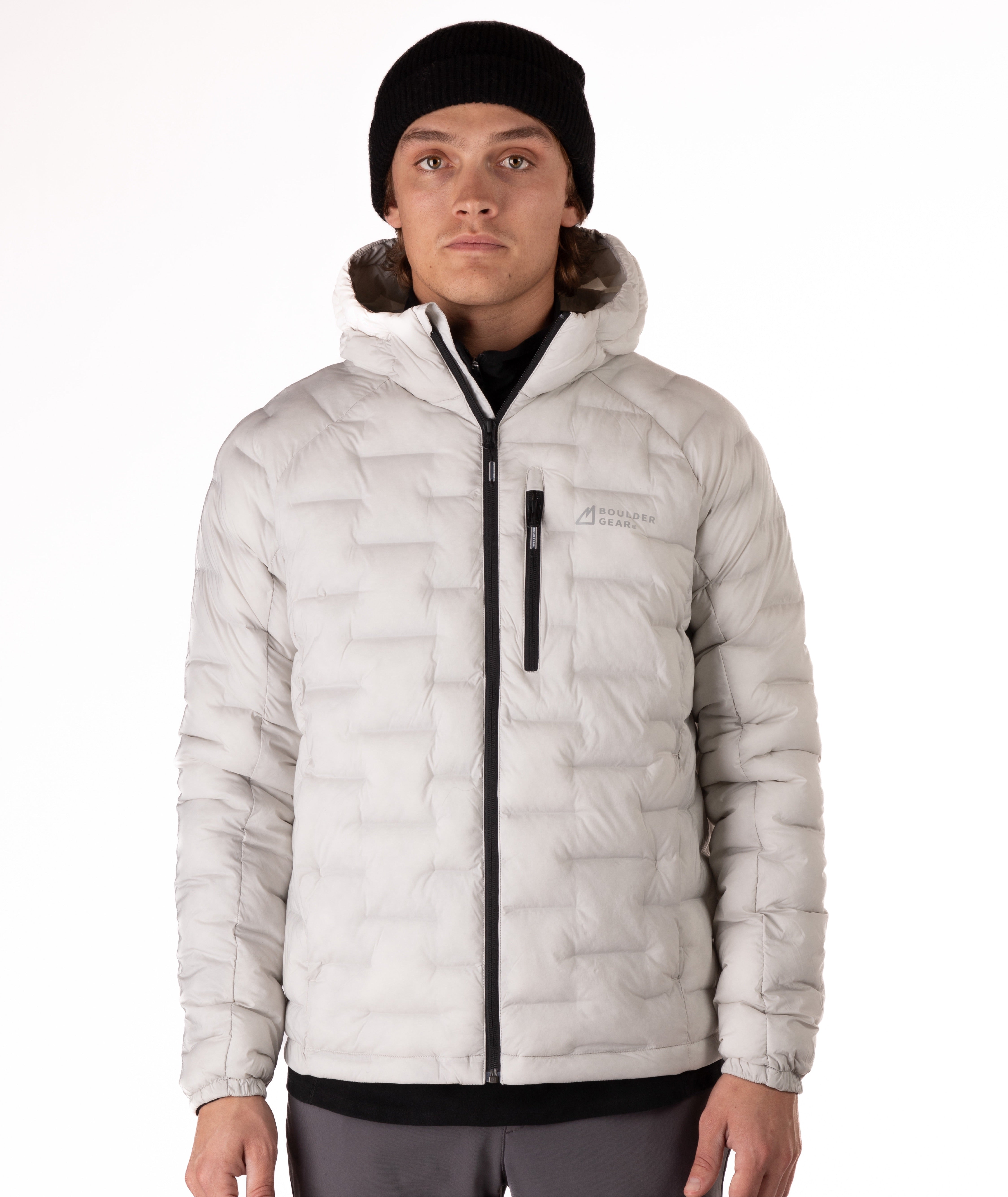 Person wearing a light gray puffer jacket with a brand logo on a white background