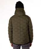 Man wearing a green puffer jacket with black zippers and a brand logo on a white background