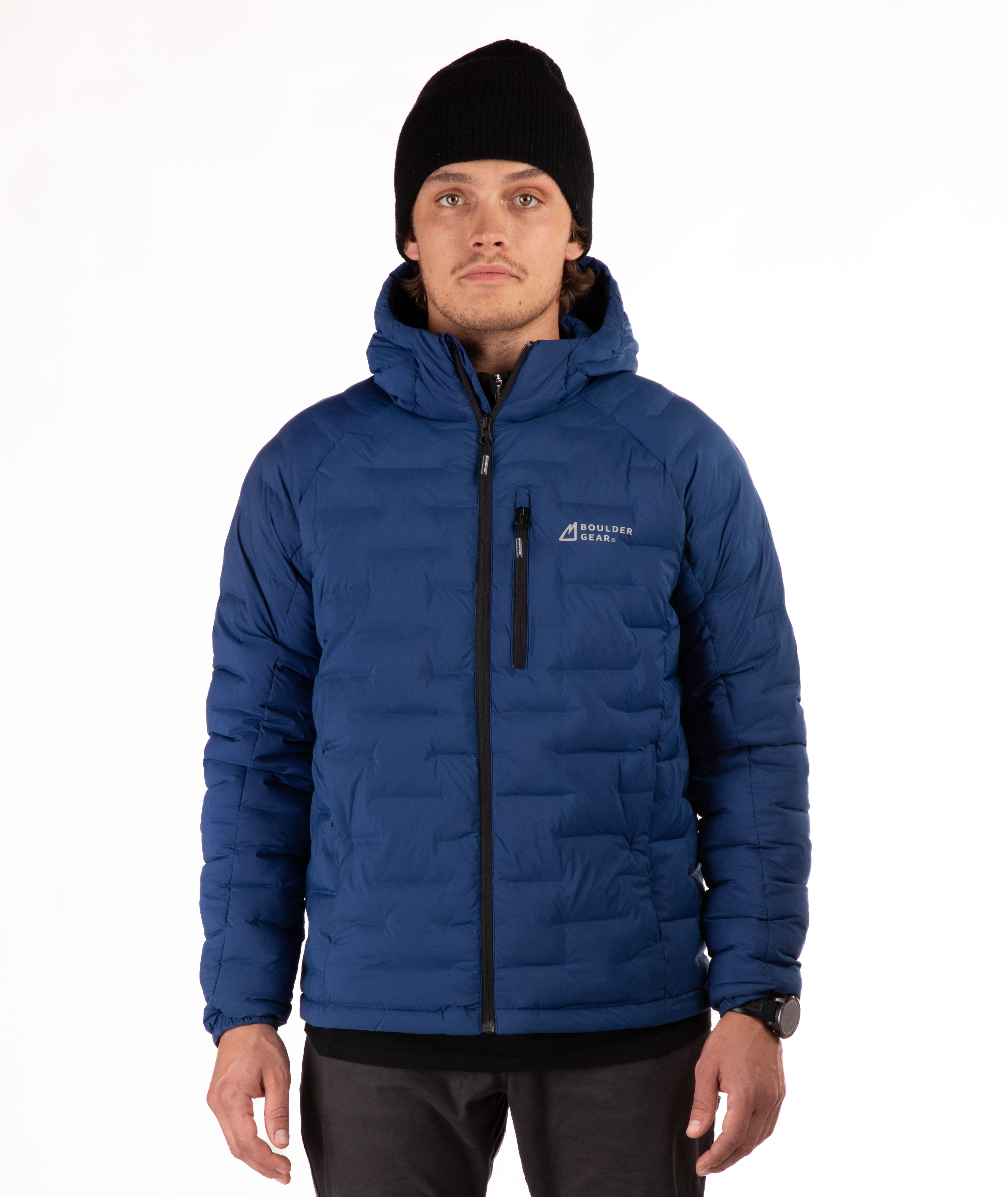 Man wearing a blue puffer jacket with black zippers and a brand logo on a white background