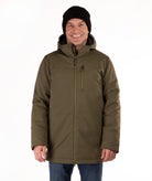 Man wearing a green hooded jacket and black beanie on a white background